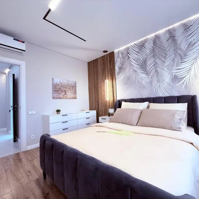 Real photos of One-bedroom apartment with a large kitchen, living room, fireplace, panoramic windows and city views.