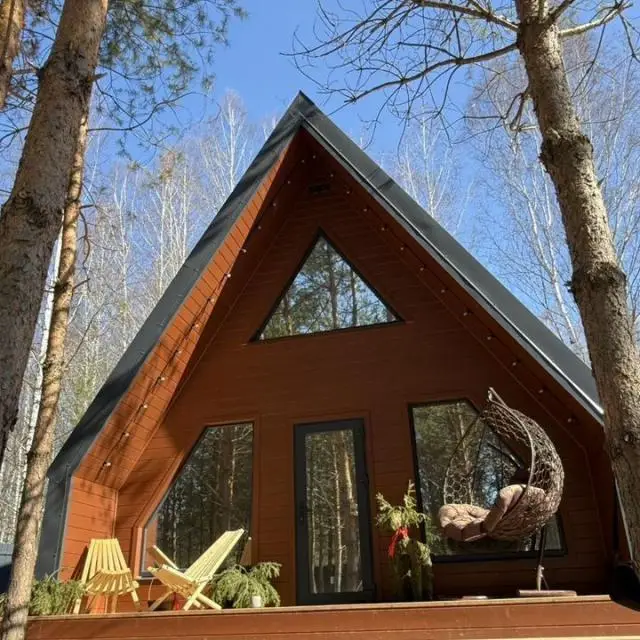 Real photos of A-frame in a pine forest near Lake Klyuchik